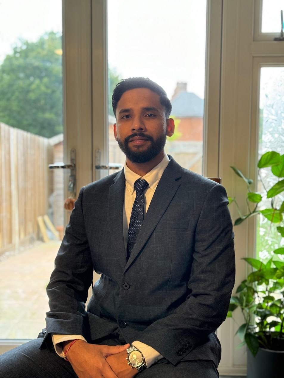 Rahil Goyal in a charcoal suit